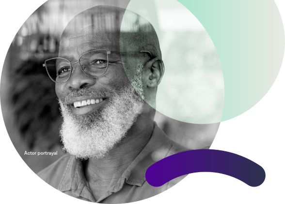 Hero image of man smiling with glasses and beard